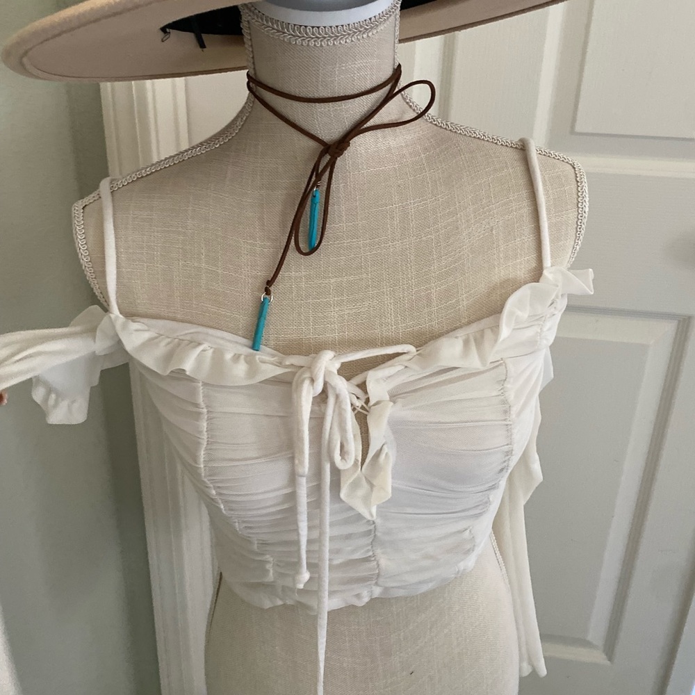 White shoulder less top